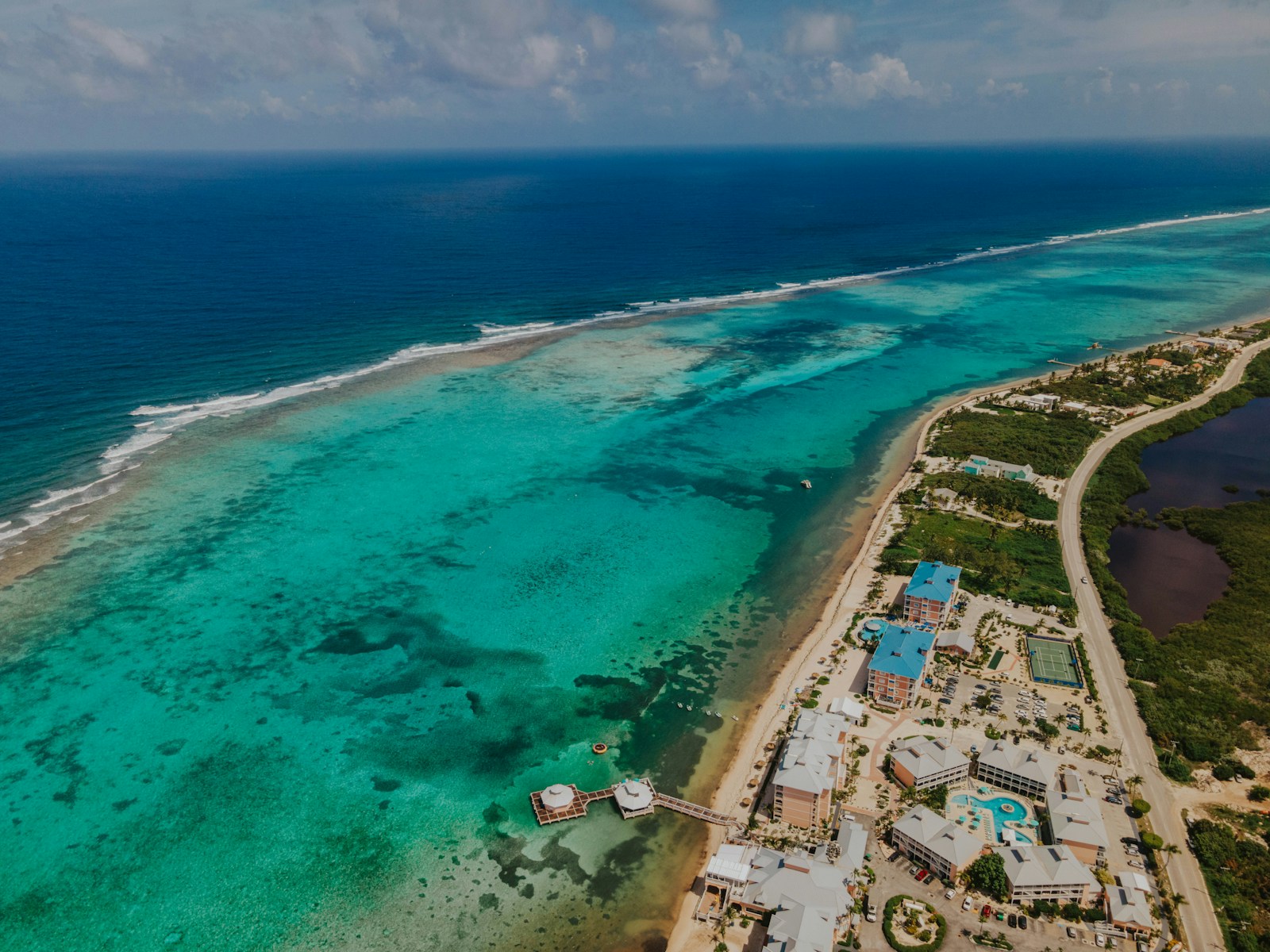 an aerial view of a beach and a body of water